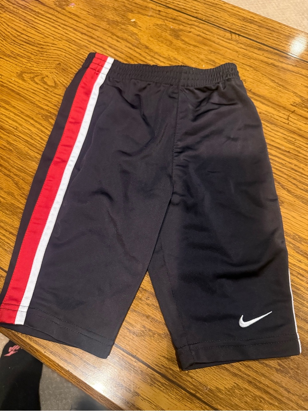 6 for $10 Nike Kids Black Athletic pants with Red and White Side Stripe